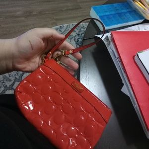 Orange coach wristlet